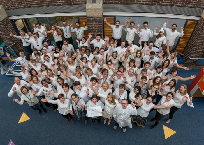 Large group of people wearing white for the Centre for Cancer Immunology