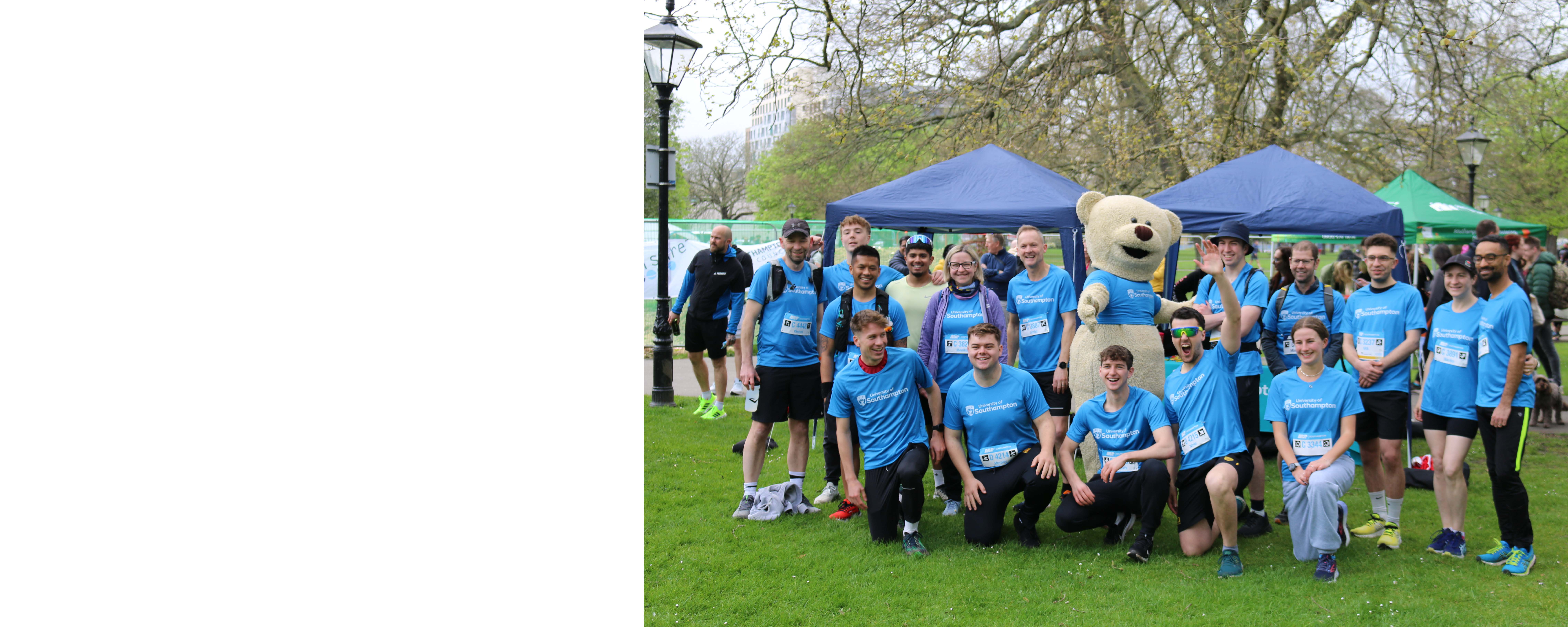 A photo of 2024 marathon runners with Hartley Bear mascot
